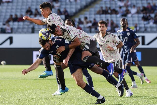 Pico (L) of Cape Verde and Diego Ulloa of Chile compete for the ball during the international friendly football match between Chile and Cape Verde at Eden Park in Auckland on March 27, 2026. (Photo by Michael Bradley / AFP)