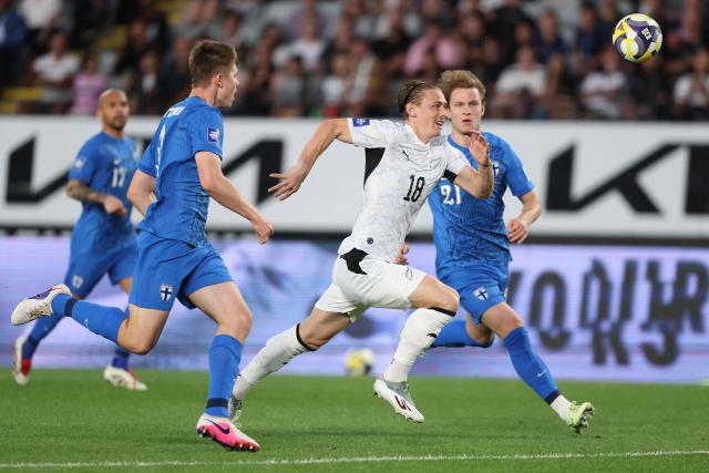 Ben Waine of New Zealand (C) chases the ball during the international friendly football match between New Zealand and Finland at Eden Park in Auckland on March 27, 2025. (Photo by Michael Bradley / AFP)