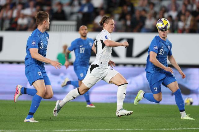 Ben Waine of New Zealand (C) chases the ball during the international friendly football match between New Zealand and Finland at Eden Park in Auckland on March 27, 2025. (Photo by Michael Bradley / AFP)