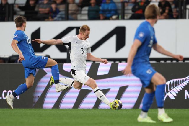 Francis De Vries of New Zealand passes the ball during the international friendly football match between New Zealand and Finland at Eden Park in Auckland on March 27, 2025. (Photo by Michael Bradley / AFP)