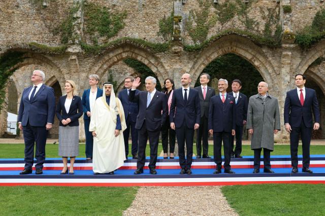 (FROM L) Ukraine's Foreign Minister Andriy Sybiga, EU High Representative and Vice-President for Foreign Affairs and Security Policy Kaja Kallas, Britain's Foreign Secretary Yvette Cooper, Saudi Arabia's Foreign Minister Faisal bin Farhan, Germany's Foreign Minister Johann Wadephul, Italy's Foreign Minister Antonio Tajani, Canada's Foreign Minister Anita Anand, France's Foreign Affairs Minister Jean-Noel Barrot, South Korea's Foreign Minister Cho Hyun, India’s Foreign Minister Subrahmanyam Jaishankar, Japan’s Foreign Minister Toshimitsu Motegi, Brazil’s Foreign Minister Mauro Vieira and US Secretary of State Marco Rubio pose for a family picture during a G7 Foreign Ministers' meeting with Partner Countries for talks at the Vaux-de-Cernay Abbey in Cernay-la-Ville outside Paris, on March 27, 2026. Foreign ministers from the G7 will take part part in a two-day meeting with European nations and allies seeking to narrow differences with the US on the Middle East war while keeping other crises like Ukraine and Gaza high on the agenda. (Photo by Alain JOCARD / AFP)
