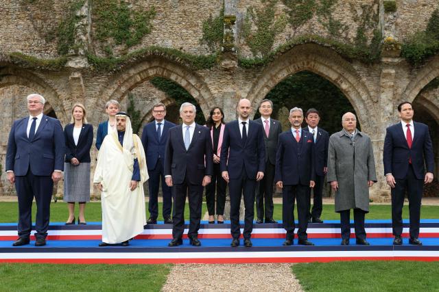 (FROM L) Ukraine's Foreign Minister Andriy Sybiga, EU High Representative and Vice-President for Foreign Affairs and Security Policy Kaja Kallas, Britain's Foreign Secretary Yvette Cooper, Saudi Arabia's Foreign Minister Faisal bin Farhan, Germany's Foreign Minister Johann Wadephul, Italy's Foreign Minister Antonio Tajani, Canada's Foreign Minister Anita Anand, France's Foreign Affairs Minister Jean-Noel Barrot, South Korea's Foreign Minister Cho Hyun, India’s Foreign Minister Subrahmanyam Jaishankar, Japan’s Foreign Minister Toshimitsu Motegi, Brazil’s Foreign Minister Mauro Vieira and US Secretary of State Marco Rubio pose for a family picture during a G7 Foreign Ministers' meeting with Partner Countries for talks at the Vaux-de-Cernay Abbey in Cernay-la-Ville outside Paris, on March 27, 2026. Foreign ministers from the G7 will take part part in a two-day meeting with European nations and allies seeking to narrow differences with the US on the Middle East war while keeping other crises like Ukraine and Gaza high on the agenda. (Photo by Alain JOCARD / AFP)