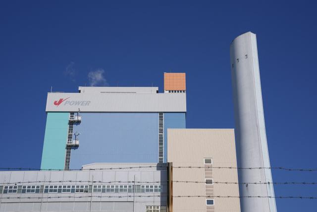 Isogo Thermal Power Station, a coal-fired power plant operated by the Electric Power Development Co., Ltd. or the brand name J-POWER, is seen in Yokohama, Kanagawa Prefecture on March 27, 2026. Japan's government plans to temporarily lift restrictions on coal-fired power plants as it seeks to ease an energy crunch caused by the Middle East war, an official said on March 27, 2026. (Photo by Kazuhiro NOGI / AFP)