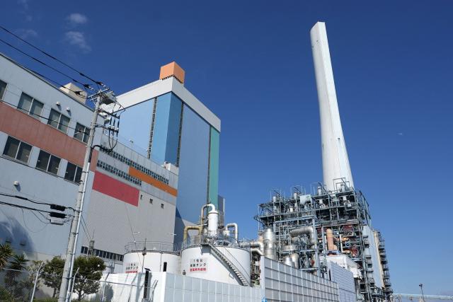 Isogo Thermal Power Station, a coal-fired power plant operated by the Electric Power Development Co., Ltd. or the brand name J-POWER, is seen in Yokohama, Kanagawa Prefecture on March 27, 2026. Japan's government plans to temporarily lift restrictions on coal-fired power plants as it seeks to ease an energy crunch caused by the Middle East war, an official said on March 27, 2026. (Photo by Kazuhiro NOGI / AFP)