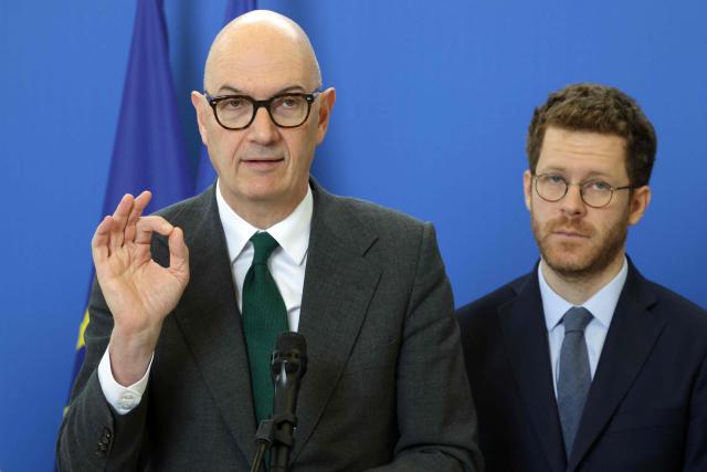 France's Economy and Finance Minister Roland Lescure (L) and France’s junior Minister for civil service David Amiel give a press conference after a ministerial meeting focusing on public finances in Paris on March 27, 2026. (Photo by Ludovic MARIN / AFP)