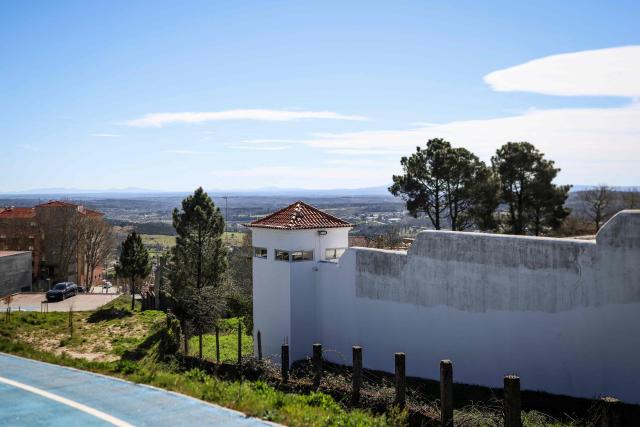 This picture partially shows the Prison in Guarda on March 27, 2026 where Cedric Prizzon, a former French police officer suspected of killing his partner and his ex-girlfriend after kidnapping them and their children, is detained. Prizzon, a one-time member of the Paris police and a former rugby league youth international, is also a fathers' rights activist who had been involved in a bitter public custody battle with his former partner. He had been stripped of his custody rights and had already been already convicted of harassing his former partner, after he illegally took their son to Spain for several weeks in 2021. (Photo by PATRICIA DE MELO MOREIRA / AFP)