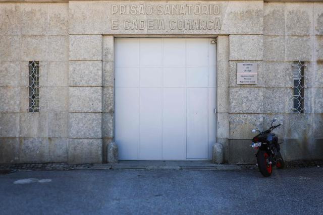 This picture shows the entrance of the Prison in Guarda on March 27, 2026 where Cedric Prizzon, a former French police officer suspected of killing his partner and his ex-girlfriend after kidnapping them and their children, is detained. Prizzon, a one-time member of the Paris police and a former rugby league youth international, is also a fathers' rights activist who had been involved in a bitter public custody battle with his former partner. He had been stripped of his custody rights and had already been already convicted of harassing his former partner, after he illegally took their son to Spain for several weeks in 2021. (Photo by PATRICIA DE MELO MOREIRA / AFP)