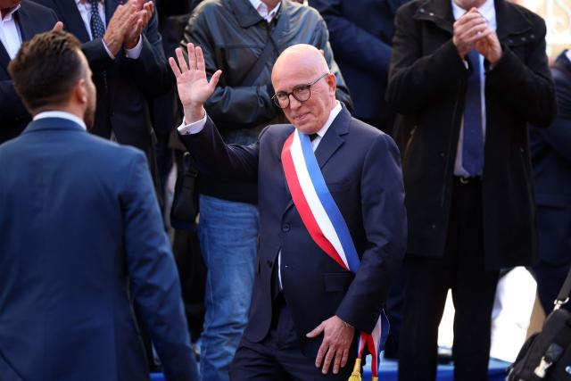 Union des droites pour la République (UDR) leader and newly elected Nice mayor Eric Ciotti waves as he arrives for the official picture after the inaugural city council session in Nice on March 27, 2026. (Photo by Valery HACHE / AFP)