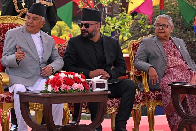 Nepal's newly sworn-in prime minister Balendra Shah (C), former interim prime minister Sushila Karki (R) and president Ram Chandra Paudel (L) look on during a swearing-in ceremony in Kathmandu on March 27, 2026. Nepal's rapper-turned-politician Balendra Shah was sworn in as prime minister on March 27 after sweeping the first election since deadly anti-corruption protests toppled the government last year. (Photo by PRAKASH MATHEMA / AFP)