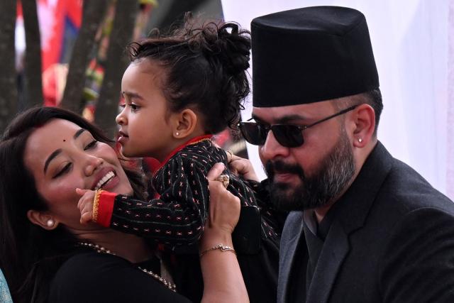 Nepal's newly sworn-in prime minister Balendra Shah with his wife Sabina Kafle and daughter Niloufer Shah attend a swearing-in ceremony in Kathmandu on March 27, 2026. Nepal's rapper-turned-politician Balendra Shah was sworn in as prime minister on March 27 after sweeping the first election since deadly anti-corruption protests toppled the government last year. (Photo by PRAKASH MATHEMA / AFP)