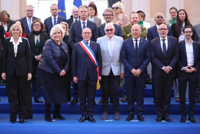 Union des droites pour la République (UDR) leader and newly elected Nice mayor Eric Ciotti (C) poses with his team for the official picture after the inaugural city council session in Nice on March 27, 2026. (Photo by Valery HACHE / AFP)