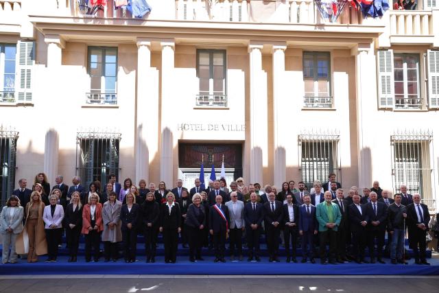 Union des droites pour la République (UDR) leader and newly elected Nice mayor Eric Ciotti (C) poses with his team for the official picture after the inaugural city council session in Nice on March 27, 2026. (Photo by Valery HACHE / AFP)
