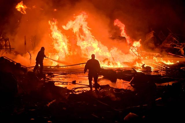 (FILES) Civil defence forces attempt to extinguish a blaze that erupted after Israeli bombardment on a solar farm and electricity generation facility in Lebanon's southern coastal city of Tyre on March 4, 2026. The United States and Israel began the war on February 28, 2026, by attacking Iran and killing its supreme leader. Iran retaliated with strikes against Israel and US allies and interests across the Gulf and Iraq, drawing the whole region into war. (Photo by Kawnat HAJU / AFP)