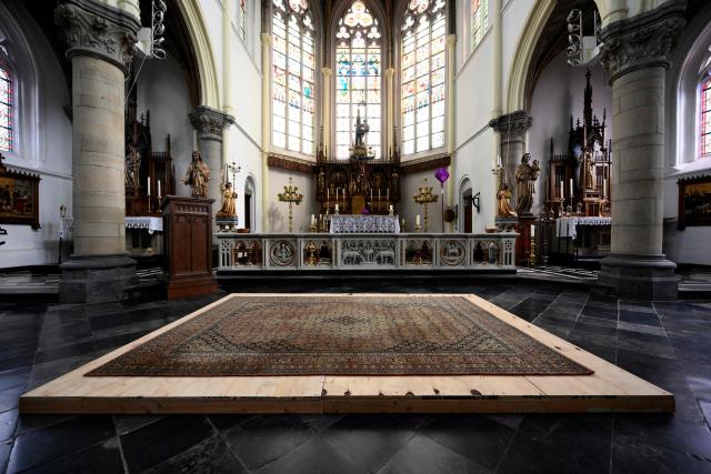 This photograph shows the inside of the Peter and Paul church in Maastricht where a skeleton which could belong to d'Artagnan, the French soldier who inspired the novel The Three Musketeers, was found in an excavation pit opened in the floor, on March 27, 2026. The skeleton was found in Maastricht, in the nave of the modern church whose origins date back to at least the 13th century, during repairs related to a partial floor collapse in February. Charles de Batz de Castelmore, known as d'Artagnan, the famous musketeer of Kings Louis XIII and Louis XIV, spent his life in the service of the French crown and was killed during the siege of Maastricht in 1673. His final resting place has remained a mystery ever since. (Photo by JOHN THYS / AFP)