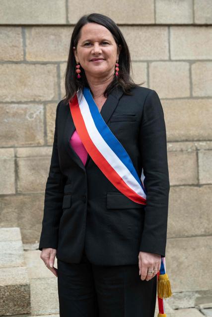 The Socialist Party (PS) mayor of Nantes Johanna Rolland poses with a tricolor scarf outside Nantes town hall, western France on March 27, 2026. (Photo by Sebastien Salom-Gomis / AFP)
