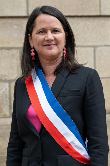 The Socialist Party (PS) mayor of Nantes Johanna Rolland poses with a tricolor scarf outside Nantes town hall, western France on March 27, 2026. (Photo by Sebastien Salom-Gomis / AFP)