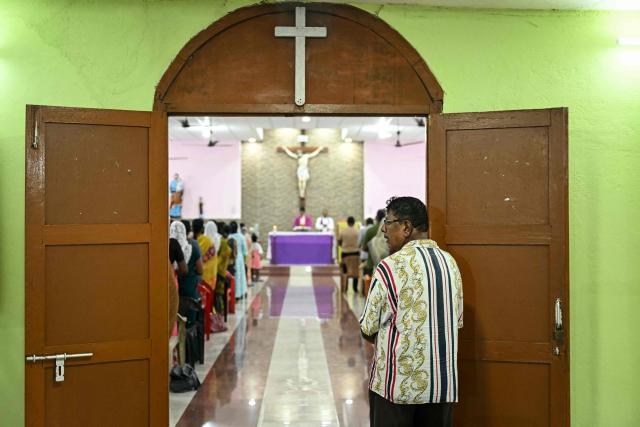 Christian devotees attend mass at St. Joseph Catholic Church near Campbell Bay on Great Nicobar Island on March 27, 2026. (Photo by R. Satish BABU / AFP)