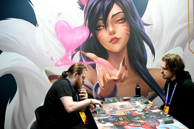 Gamers play Riftbound, a Trading Card game during DreamHack 2026 at the NEC in Birmingham, central England on March 27, 2026. (Photo by Oli SCARFF / AFP)
