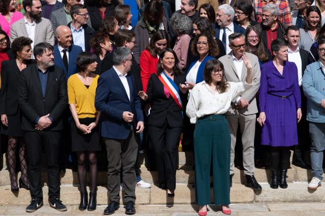 French socialist party (PS)  re-elected mayor of Nantes Johanna Rolland (C) poses with the new elected municipal council outside the town hall of Nantes, western France, on March 27, 2026. (Photo by Sebastien Salom-Gomis / AFP)