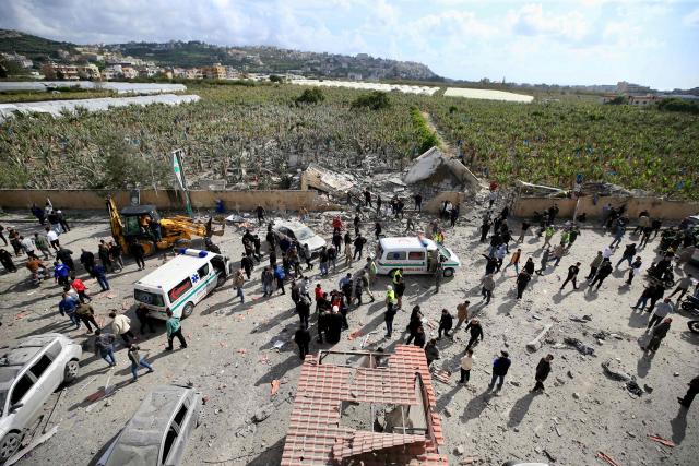 First aid responders rush to the site of an Israeli aistrike that targeted a building in the southern Lenanese village of Sarafand on March 27, 2026. Hezbollah said on March 27 its fighters had clashed directly with Israeli forces in two south Lebanon villages, as Israeli airstrikes across the region killed at least six people, according to the health ministry. Lebanon was pulled into the Middle East war when Tehran-backed militant group Hezbollah fired rockets towards Israel on March 2 to avenge the US-Israeli killing of Iran's supreme leader Ayatollah Ali Khamenei. (Photo by AFP) / 