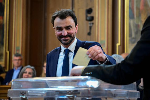 Newly re-elected Lyon mayor Gregory Doucet casts his vote during the inaugural city council session in Lyon, central-eastern France, on March 27, 2026. (Photo by OLIVIER CHASSIGNOLE / AFP)