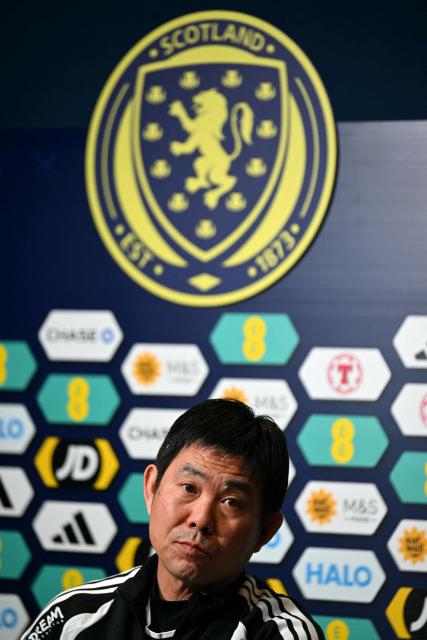 Japan's Head Coach Hajime Moriyasu attends a press conference at Hampden Park, in Glasgow, on March 27, 2026, on the eve of their international friendly football match against Scotland. (Photo by ANDY BUCHANAN / AFP)