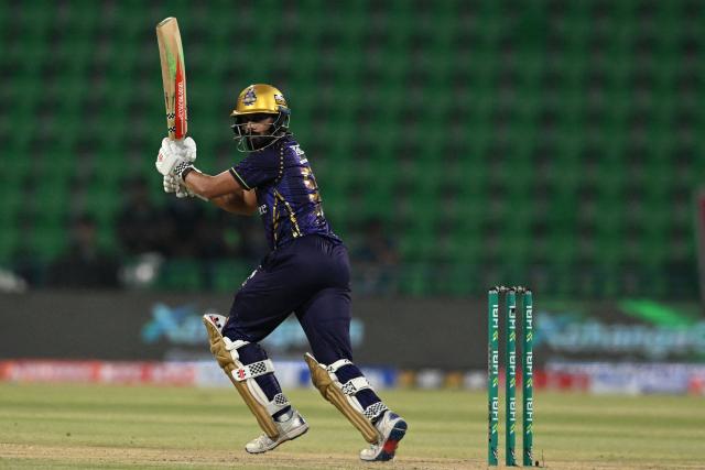 Quetta Gladiators' Shamyl Hussain plays a shot during the Pakistan Super League (PSL) Twenty20 cricket match between Quetta Gladiators and Karachi Kings at the Qaddafi Cricket Stadium in Lahore on March 27, 2026. (Photo by Arif ALI / AFP)