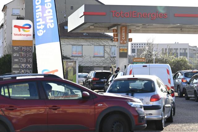 The daily prices for E10, SP98, Super Ethanol and diesel are displayed at a Total Access station in Forbach, northeastern France, on March 27, 2026. Many Germans living near the border come to France to fill up their tanks as prices are higher in Germany. (Photo by Jean-Christophe VERHAEGEN / AFP)
