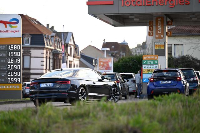 The daily prices for E10, SP98, Super Ethanol and diesel are displayed at a Total Access station in Forbach, northeastern France, on March 27, 2026. Many Germans living near the border come to France to fill up their tanks as prices are higher in Germany. (Photo by Jean-Christophe VERHAEGEN / AFP)