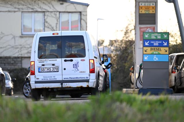 A German car is parked at a Total Access station in Forbach, northeastern France, on March 27, 2026. Many Germans living near the border come to France to fill up their tanks as prices are higher in Germany. (Photo by Jean-Christophe VERHAEGEN / AFP)