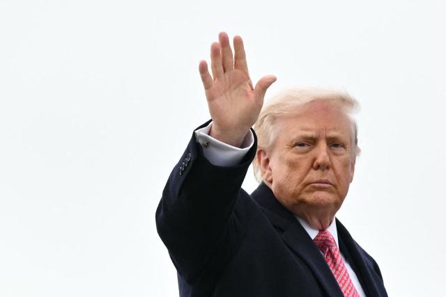 US President Donald Trump waves as he boards Air Force One at Joint Base Andrews in Maryland on March 27, 2026. Trump is heading to Miami to speak at a Summit before spending the weekend at his Mar-a-Lago resort. (Photo by Mandel NGAN / AFP)