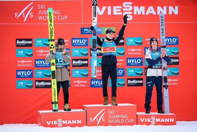 (From L) Second placed Japan’s Ren Nikaido, winner Slovenia’s Domen Prevc and third placed Austria’s Daniel Tschofenig pose for photos on the podium of the Men Individual Flying Hill competition of the FIS Ski Jumping World Cup in Planica, Slovenia on March 27, 2026. (Photo by Jure Makovec / AFP)