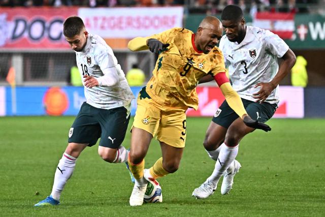 Austria's midfielder #18 Romano Schmid (L), Ghana's forward #09 Jordan Ayew (C) and Austria's defender #03 Kevin Danso vie for the ball during the friendly match Austria vs Ghana in Vienna, Austria, on March 27, 2026. (Photo by Joe Klamar / AFP)