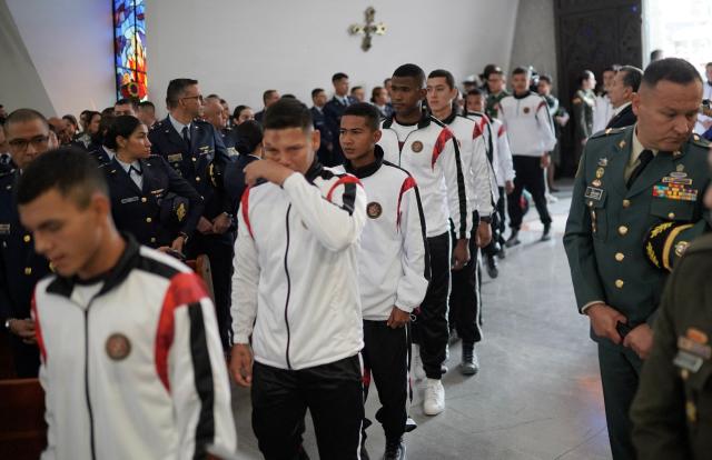 Survivors of the Air Force Hercules accident arrive for a religious ceremony in Bogota on March 27, 2026. The death toll in one of Colombia's worst air accidents in recent years rose to at least 69, according to an updated tally on March 24, as the government faulted a "junk" aircraft donated by the United States. (Photo by Sergio Yate / AFP)