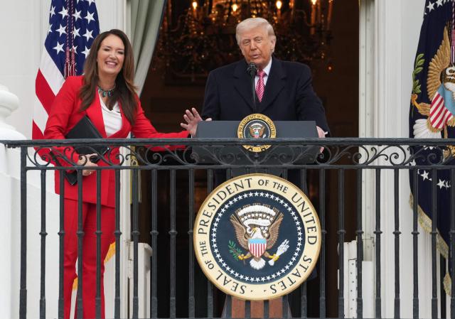 US President Donald Trump and US Secretary of Agriculture Brooke Rollins address farmers from the Truman balcony of the White House in Washington, DC, on March 27, 2026. (Photo by Ken Cedeno / AFP)