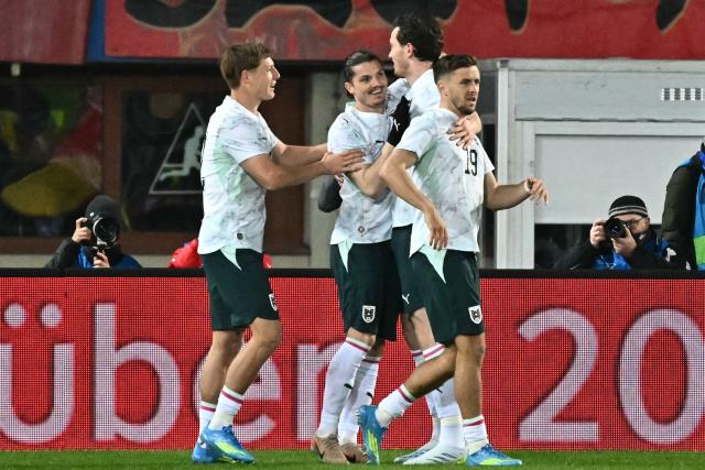 Austria's forward #11 Michael Gregoritsch (2nd R) is celebrated by team mates after scoring the 2-0 goal during the friendly football match Austria vs Ghana in Vienna, Austria, on March 27, 2026. (Photo by Joe Klamar / AFP)