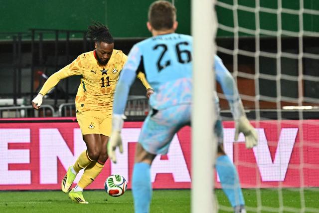 Ghana's forward #11 Antoine Semenyo (L) controls the ball as Austria's goalkeeper #26 Florian Wiegele eyes the ball during the friendly football match Austria vs Ghana in Vienna, Austria, on March 27, 2026. (Photo by Joe Klamar / AFP)