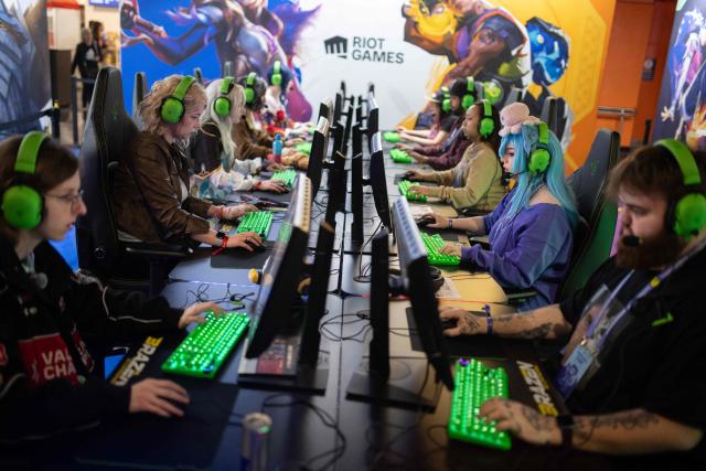 Gamers plays League of Legends during the DreamHack 2026 gaming convention at the NEC in Birmingham, central England on March 27, 2026. (Photo by Oli SCARFF / AFP)