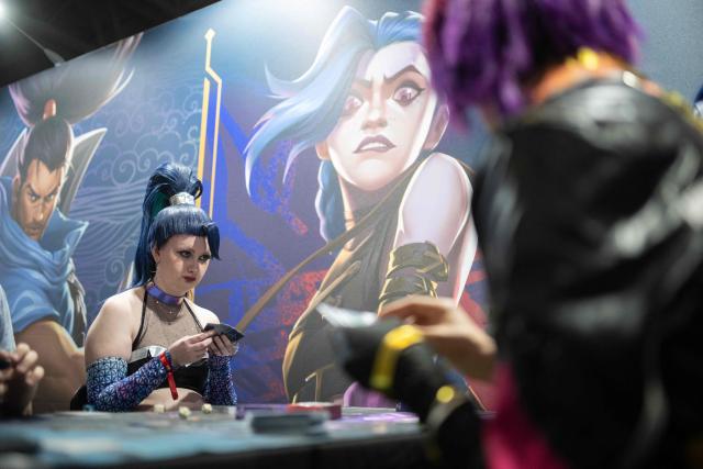 Gamers play Riftbound, a Trading Card game, during the DreamHack 2026 gaming convention at the NEC in Birmingham, central England on March 27, 2026. (Photo by Oli SCARFF / AFP)