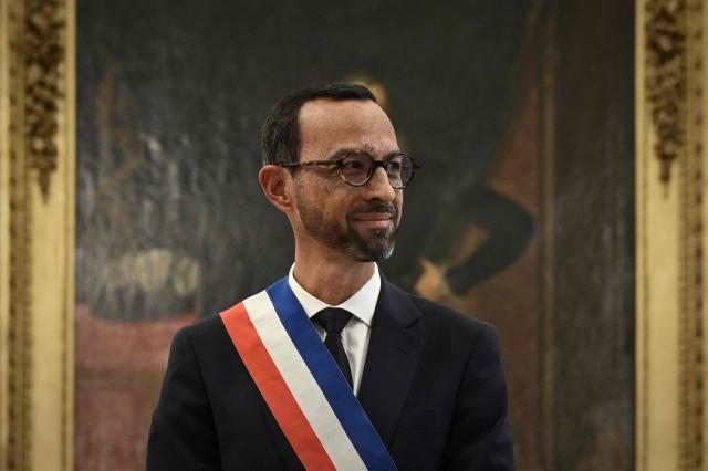 Pau's new Mayor Jerome Marbot reacts after receiving the tricolour mayoral sash during his installation as Mayor of Pau at the City Hall (Hotel de Ville) of Pau, south-western France, on March 27, 2026. Marbot, a public and environmental law attorney, defeated outgoing MoDem leader Francois Bayrou by 344 votes in the second round of municipal elections on March 22. (Photo by Philippe LOPEZ / AFP)