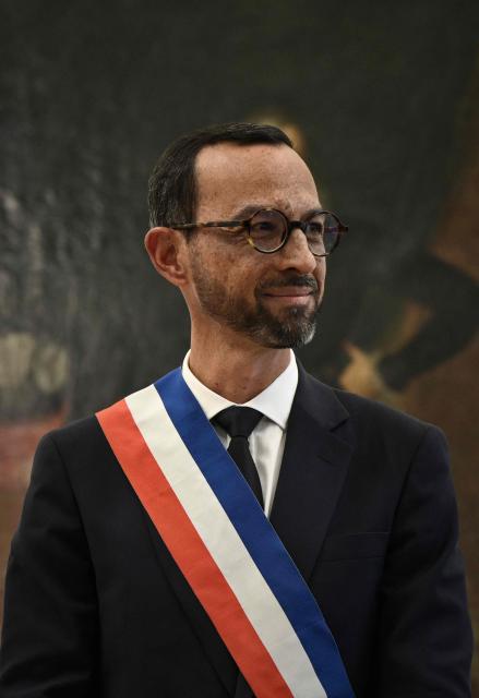 Pau's new Mayor Jerome Marbot reacts after receiving the tricolour mayoral sash during his installation as Mayor of Pau at the City Hall (Hotel de Ville) of Pau, south-western France, on March 27, 2026. Marbot, a public and environmental law attorney, defeated outgoing MoDem leader Francois Bayrou by 344 votes in the second round of municipal elections on March 22. (Photo by Philippe LOPEZ / AFP)