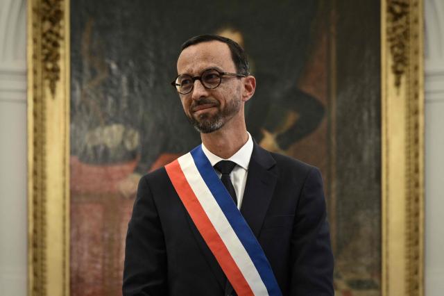 Pau's new Mayor Jerome Marbot reacts after receiving the tricolour mayoral sash during his installation as Mayor of Pau at the City Hall (Hotel de Ville) of Pau, south-western France, on March 27, 2026. Marbot, a public and environmental law attorney, defeated outgoing MoDem leader Francois Bayrou by 344 votes in the second round of municipal elections on March 22. (Photo by Philippe LOPEZ / AFP)