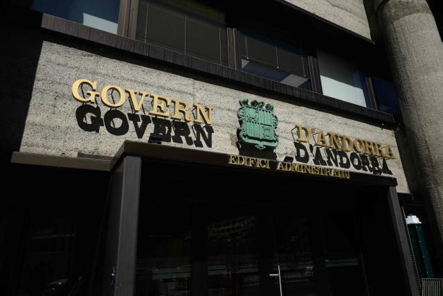This photograph shows the entrance to the administrative offices of the government of Andorra, in Andorra on March 26, 2026. Enclosed between France and Spain, the principality—whose co-princes are French President Emmanuel Macron and the Catholic bishop of the Spanish border town of Urgell, Bishop Josep-Lluis Serrano Pentinat, are the co-princes, is, along with the Vatican, the only state in Europe to completely ban abortion, even in cases of rape, incest, danger to the mother, or fetal illness.  The head of the government of the Principality of Andorra, where abortion remains prohibited under all circumstances, told AFP that he is hopeful of “decriminalizing” abortion within a year, but without legalizing it, ruling out any changes to Andorran institutions. (Photo by Ed JONES / AFP)