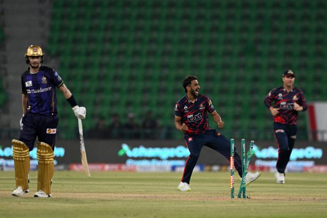 Karachi kings' Hassan Ali celebrates with teammates after taking the wicket of Quetta Gladiators' Tom Curran during the Pakistan Super League (PSL) Twenty20 cricket  match between Karachi Kings and Quetta Gladiators at the Qaddafi Cricket Stadium in Lahore on March 27, 2026. (Photo by Arif ALI / AFP)