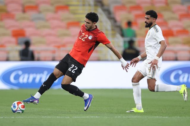 Egypt's forward #22 Omar Marmoush controls the ball from Saudi's defender #4 Addulelah Almari during the friendly football match between Saudi Arabia and Egypt at King Abdullah Sports City in Jeddah on March 27, 2026. (Photo by AFP)