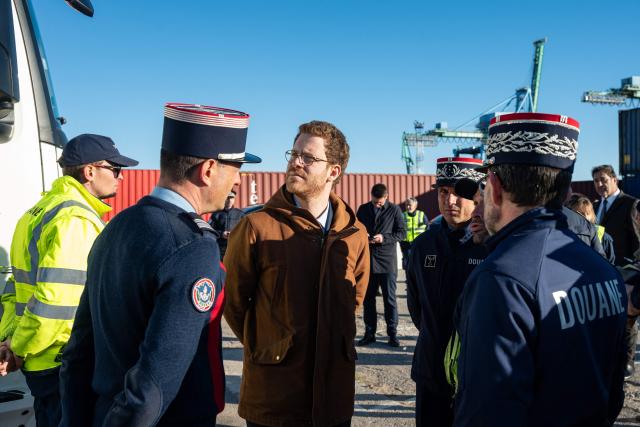 France's junior Minister for Public Accounts David Amiel (C) looks on as he takes part in a visit of the Grand Port Maritime of Marseille, southeastern France on March 27, 2026.  (Photo by Elodie CLEMENT / AFP)