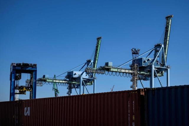 This photograph shows cranes and intermodal containers during the visit of France's junior Minister for Public Accounts at the Grand Port Maritime of Marseille, southeastern France on March 27, 2026.  (Photo by MIGUEL MEDINA / AFP)