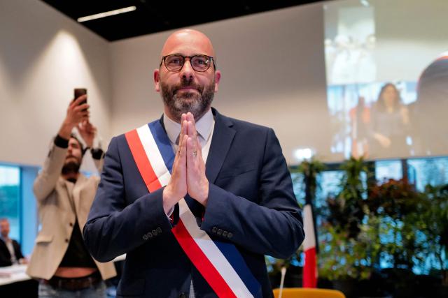 Newly elected mayor of Nimes Vincent Bouget reacts after receiving his mayoral sash during the inaugural city council session in Nimes, southern France, on March 27, 2026. (Photo by Sylvain THOMAS / AFP)