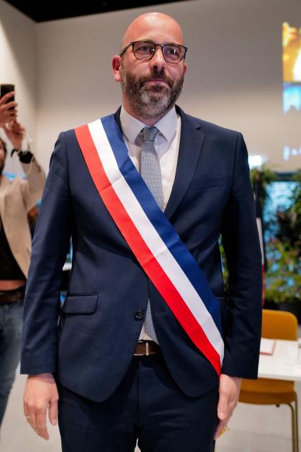 Newly elected mayor of Nimes Vincent Bouget poses after receiving his mayoral sash during the inaugural city council session in Nimes, southern France, on March 27, 2026. (Photo by Sylvain THOMAS / AFP)