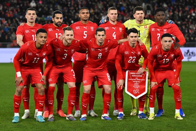 Switzerland's starting squad pose for a group picture ahead of the international friendly football match between Switzerland and Germany at St.Jakob-Park in Basel, Switzerland on March 27, 2026. (Photo by Fabrice COFFRINI / AFP)